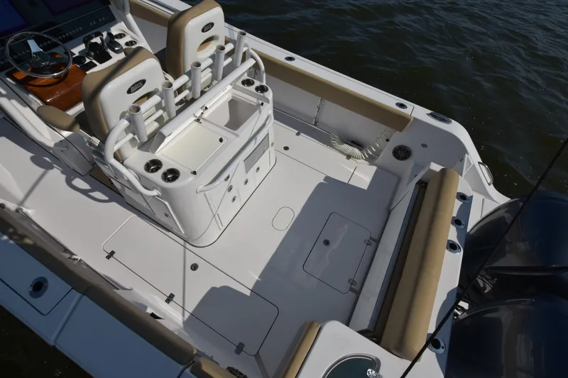 Slide: The Image of 2016 Sportsman Open 312 Center Console boat interior with seating and storage. - 29