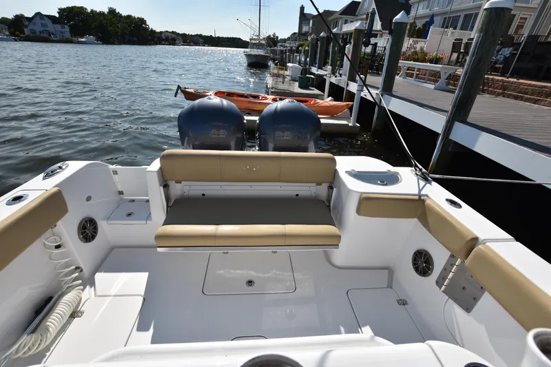 Slide: The Image of 2016 Sportsman Open 312 Center Console boat docked by waterfront homes. - 7