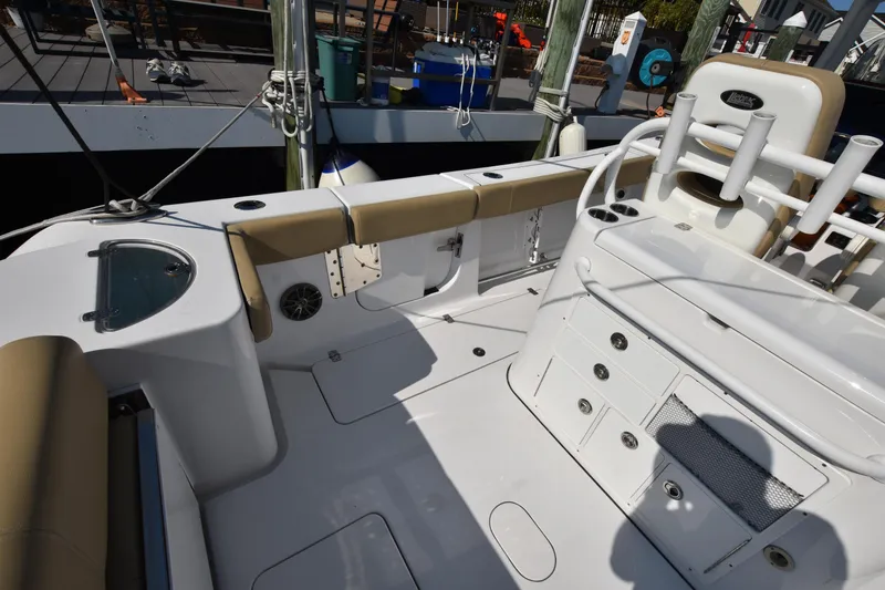 Slide: The Image of 2016 Sportsman Open 312 Center Console boat interior with seating and storage compartments. - 9