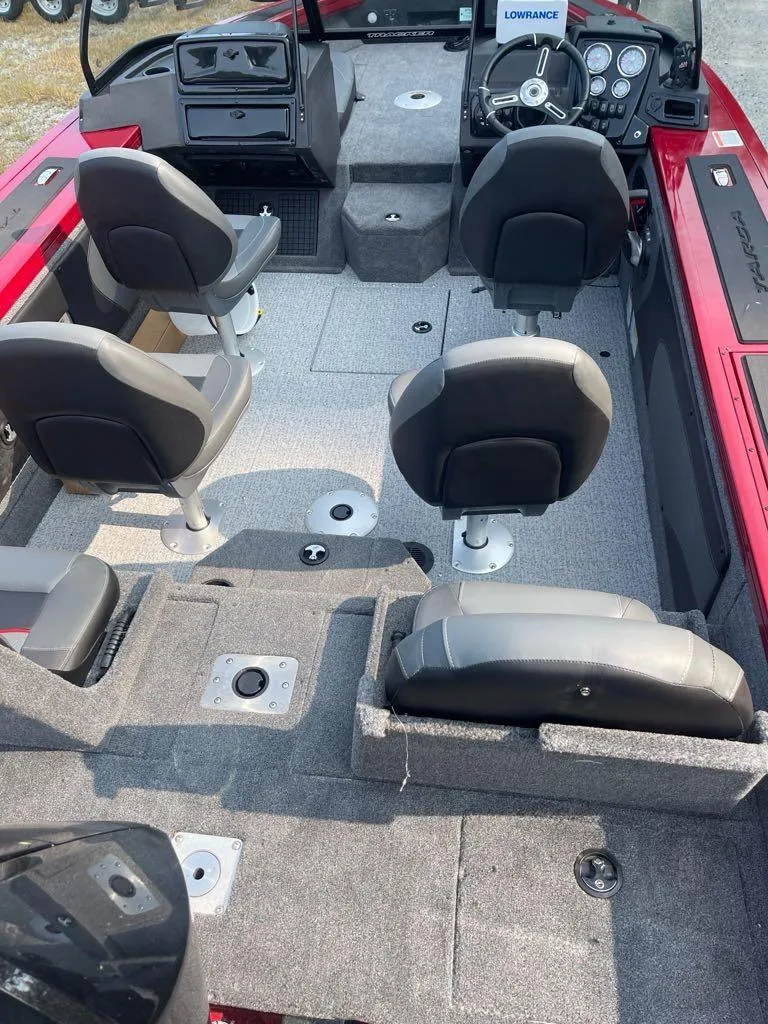Slide: The Image of 2024 Tracker Targa V-19 Combo boat interior with seating and dashboard. - 2