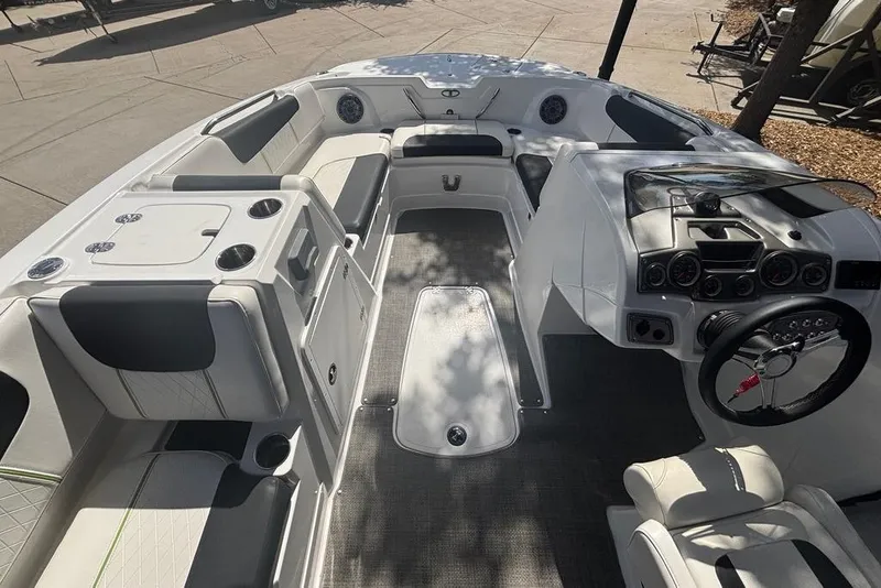 Slide: The Image of Interior of a 2024 Tahoe 1950 boat featuring seating and control panel. - 5