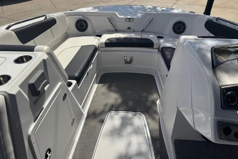 Slide: The Image of Interior of 2024 Tahoe 1950 boat, featuring seating and cup holders. - 10