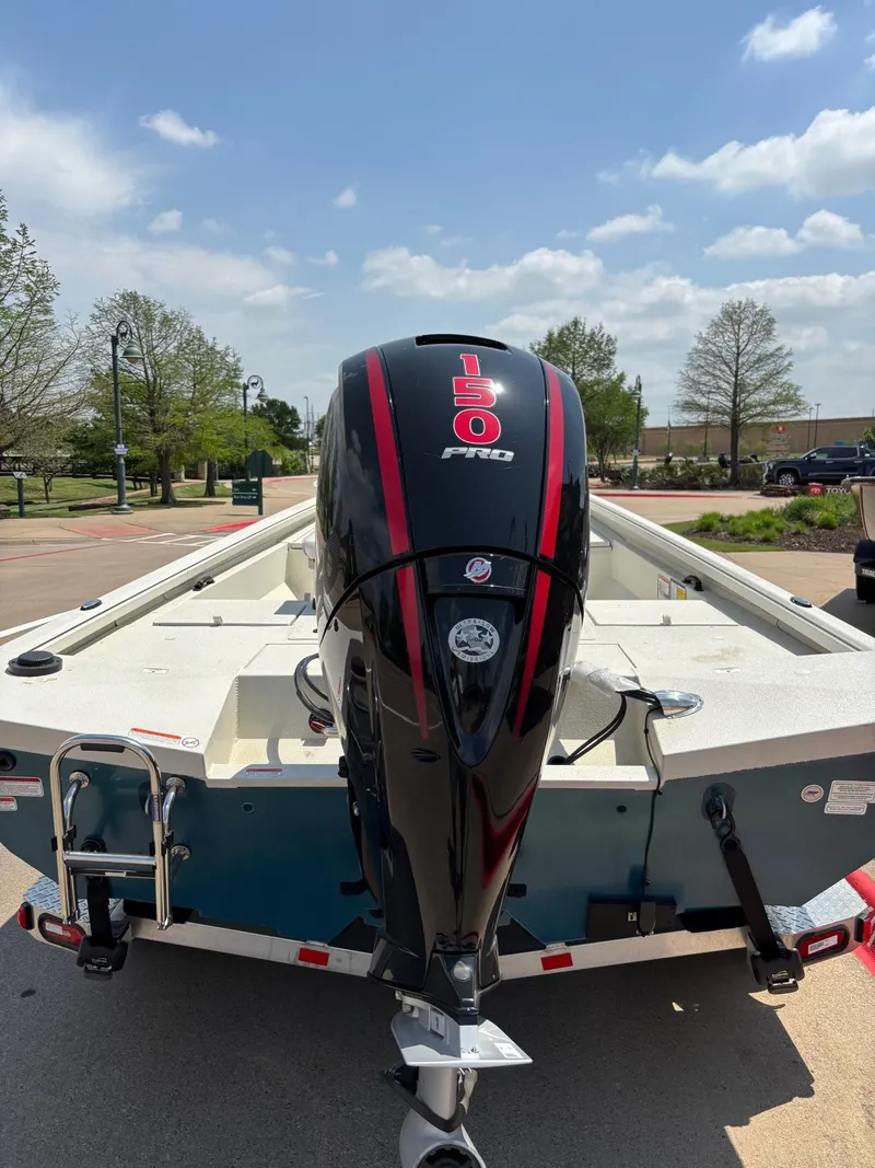 Slide: The Image of 2024 Ranger RB200 boat with Lowrance navigation system, parked on a trailer in a lot. - 3