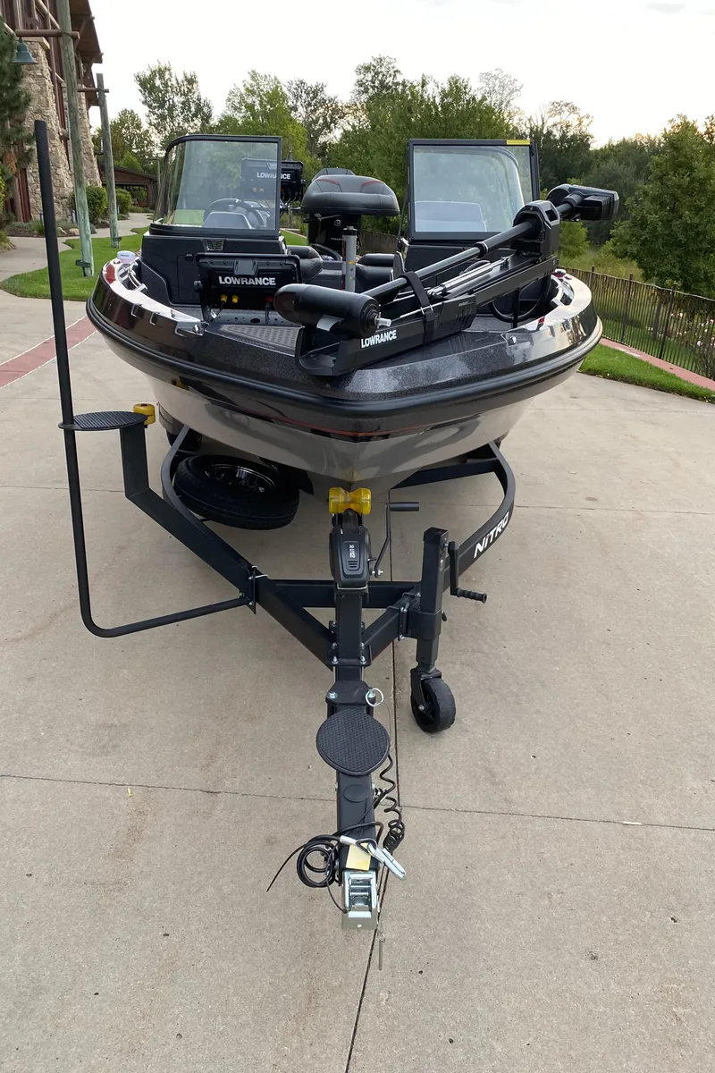 Slide: The Image of 2024 Nitro ZV20 Pro fishing boat on trailer, featuring advanced navigation equipment. - 2
