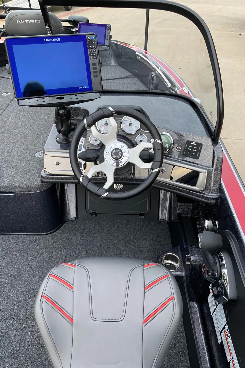 Slide: The Image of 2024 Nitro ZV20 Pro boat cockpit with steering wheel and navigation display. - 8