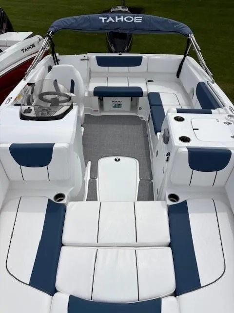 Slide: The Image of 2024 Tahoe 2150 boat interior with blue and white seating, spacious layout, and modern design. - 3