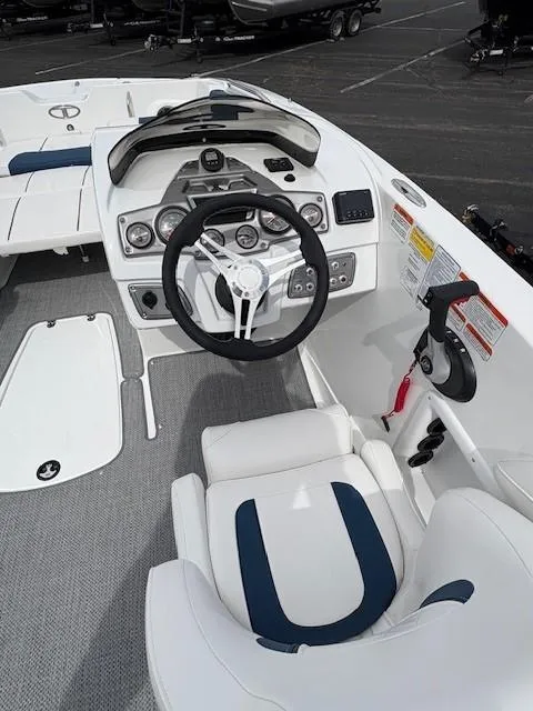 Slide: The Image of 2024 Tahoe 2150 boat cockpit with steering wheel and control panel. - 4