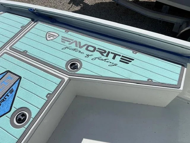 Slide: The Image of Lowe Bay 22 boat deck, 2022 model, featuring "Favorite" fishing logo. - 12