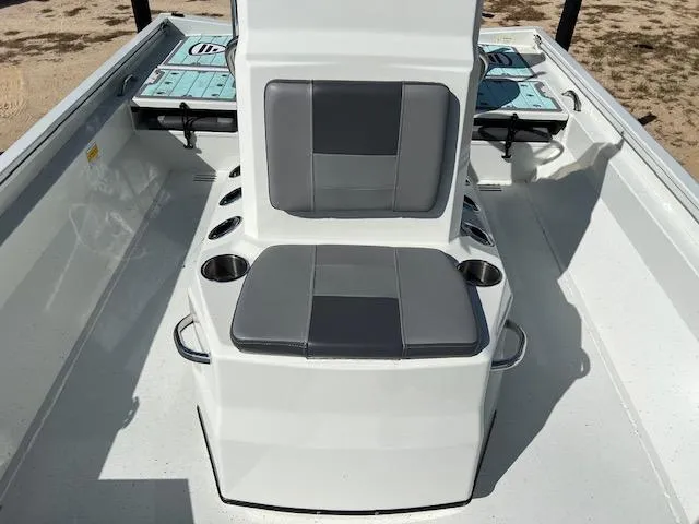 Slide: The Image of 2022 Lowe Bay 22 boat interior with gray seating and cup holders. - 9