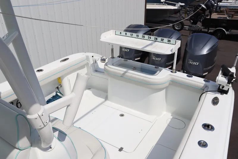 Slide: The Image of 2018 Yellowfin 36 Offshore boat interior with triple 300 horsepower engines. - 12