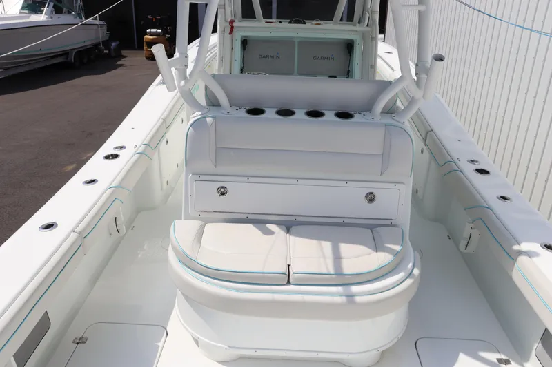 Slide: The Image of 2018 Yellowfin 36 Offshore boat interior with seating and rod holders. - 13