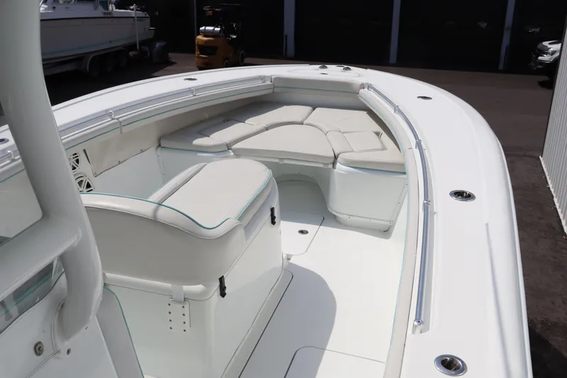Slide: The Image of 2018 Yellowfin 36 Offshore boat interior with cushioned seating and sleek design. - 15