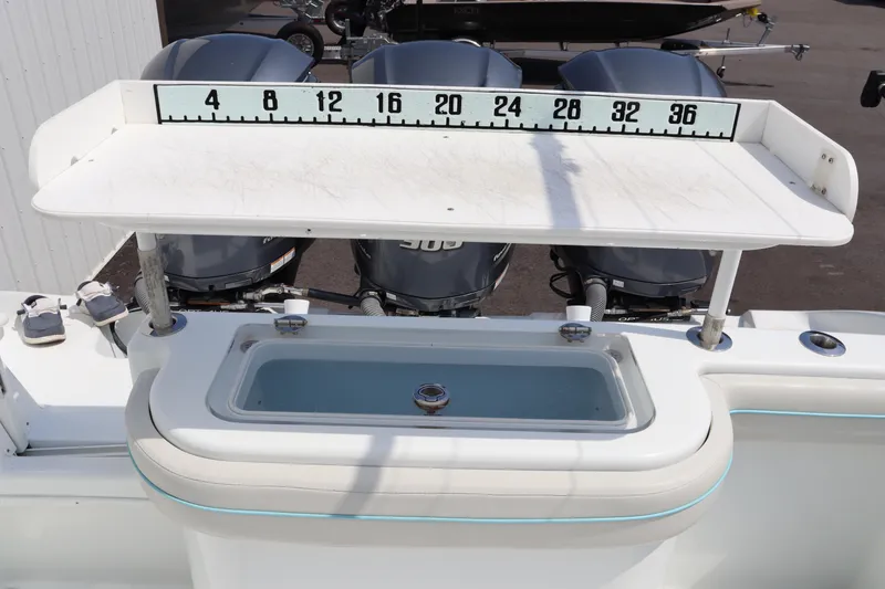 Slide: The Image of 2018 Yellowfin 36 Offshore boat with measuring station and triple outboard motors. - 16