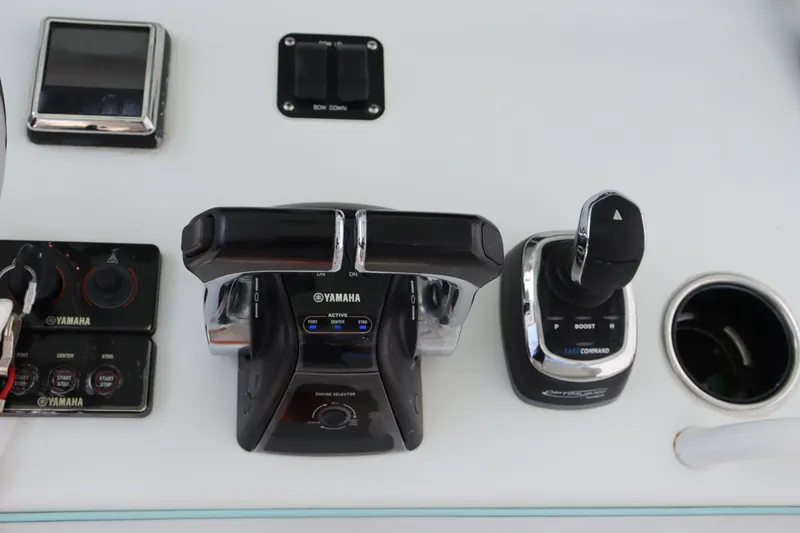 Slide: The Image of Yamaha controls on 2018 Yellowfin 36 Offshore boat dashboard. - 23
