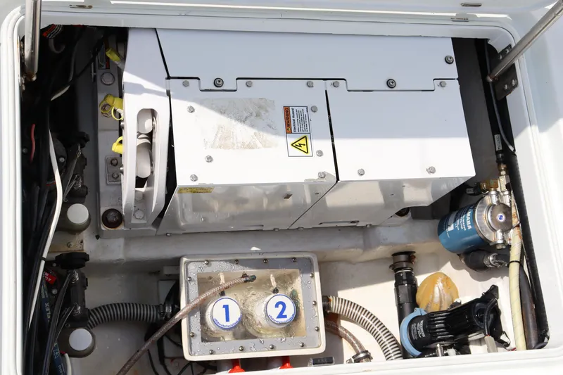 Slide: The Image of Engine compartment of 2018 Yellowfin 36 Offshore boat, showcasing mechanical components and wiring. - 29