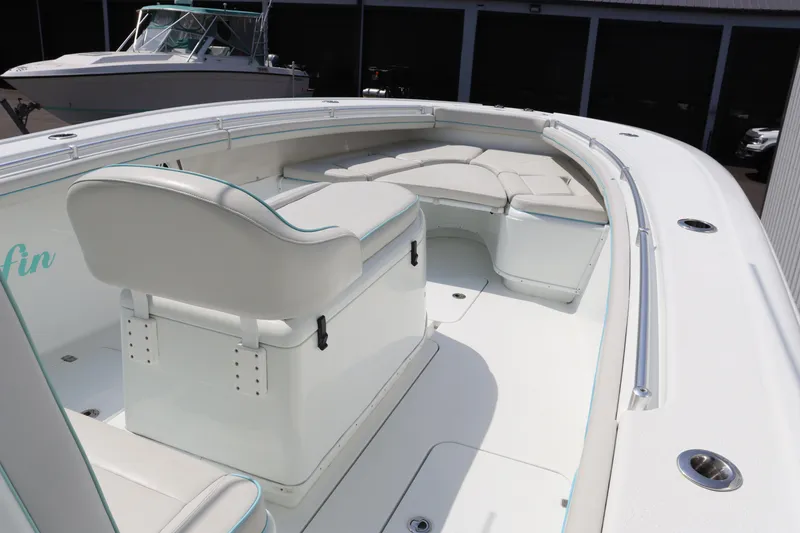 Slide: The Image of 2018 Yellowfin 36 Offshore boat interior with white seating and spacious deck. - 30