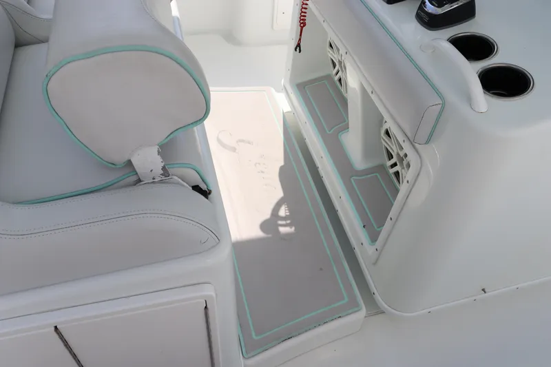 Slide: The Image of 2018 Yellowfin 36 Offshore boat interior with white seating and console. - 38