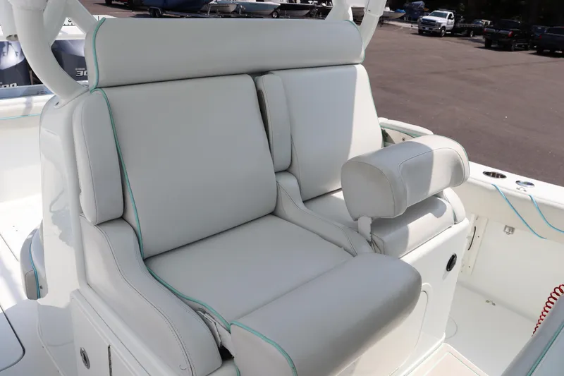Slide: The Image of 2018 Yellowfin 36 Offshore boat seating with white upholstery. - 39