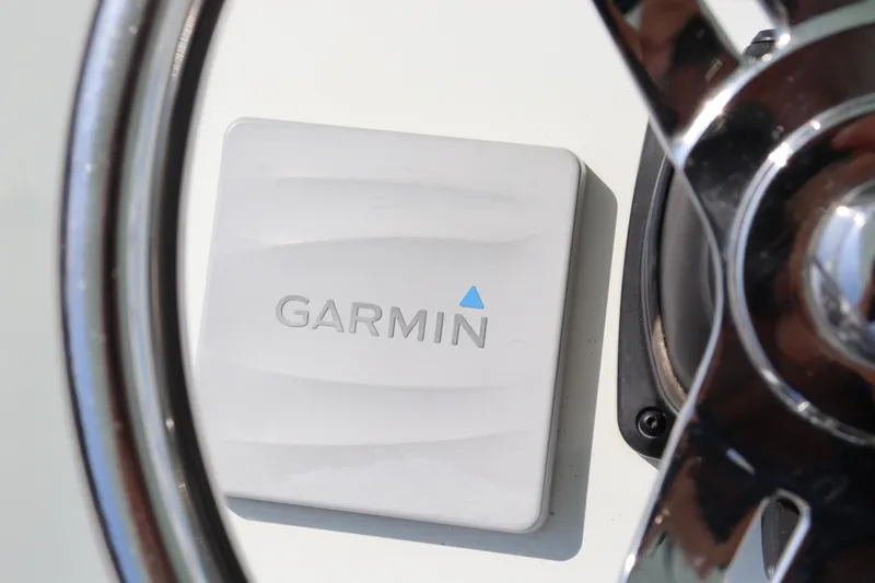 Slide: The Image of Garmin device on 2018 Yellowfin 36 Offshore boat dashboard, near steering wheel. - 44