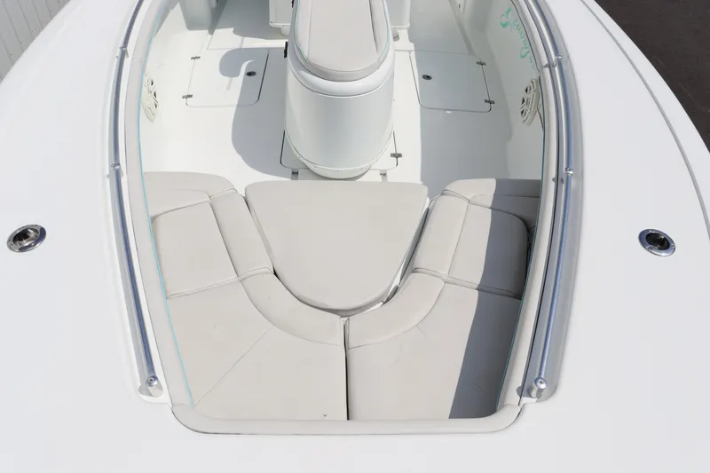 Slide: The Image of 2018 Yellowfin 36 Offshore boat interior with cushioned seating. - 8