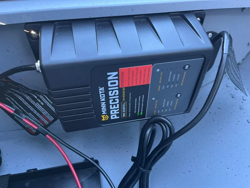 Slide: The Image of Minn Kota Precision charger in 2025 Lund 1600 Fury Tiller boat. - 18