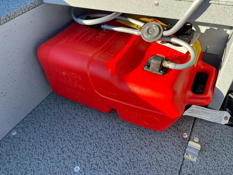 Slide: The Image of Red fuel tank in a 2025 Lund 1600 Fury Tiller boat. - 20