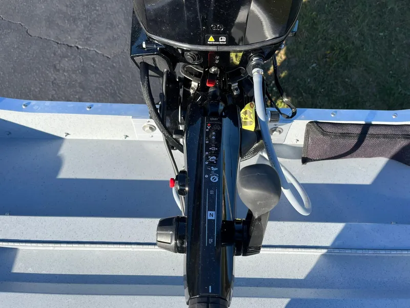 Slide: The Image of 2025 Lund 1600 Fury Tiller boat engine controls, top view. - 21