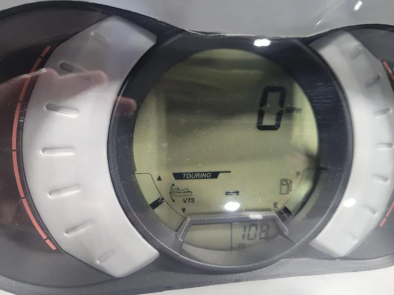 Slide: The Image of Close-up of 2019 Sea-Doo GTI SE 155 dashboard displaying 0 MPH and touring mode. - 4