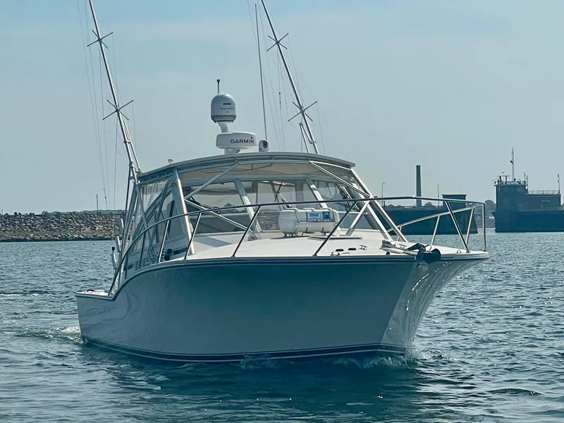 Slide: The Image of 2006 Carolina Classic 35 boat on water, equipped with Garmin technology. - 2