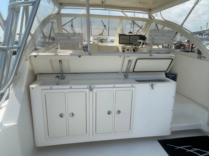 Slide: The Image of 2006 Carolina Classic 35 boat interior with helm and storage compartments. - 20