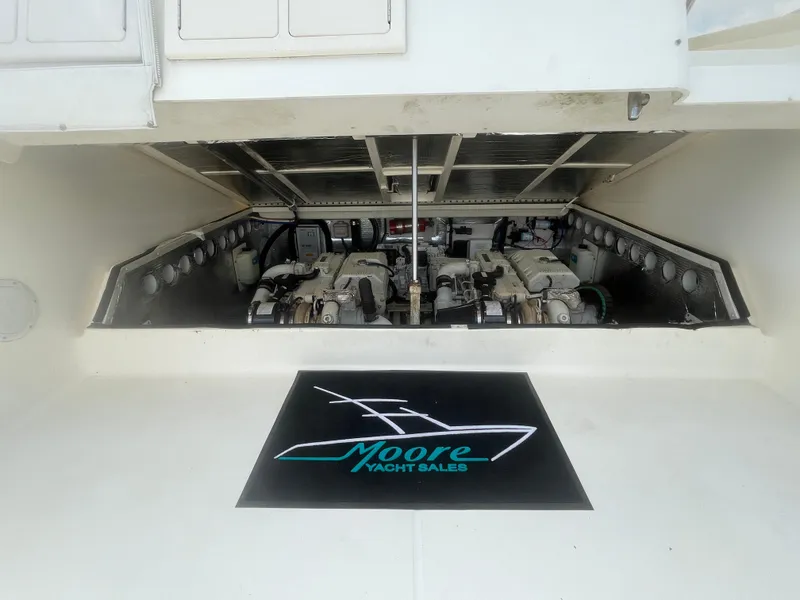 Slide: The Image of Engine compartment of a 2006 Carolina Classic 35 yacht, featuring dual engines. - 22