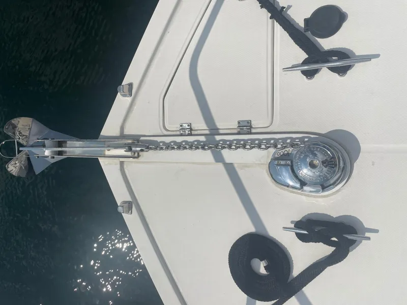 Slide: The Image of Anchor and chain mechanism on a 2006 Carolina Classic 35 boat deck. - 23