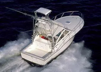 Slide: The Image of 2006 Carolina Classic 35 boat cruising on open water, aerial view. - 9