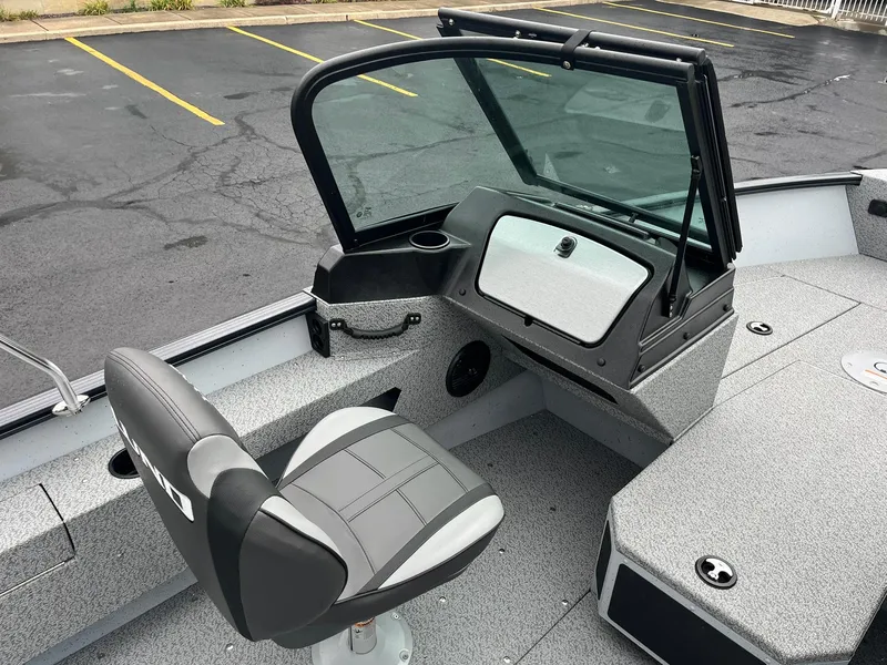 Slide: The Image of 2025 Lund 1775 Adventure Sport boat interior with seating and console. - 10