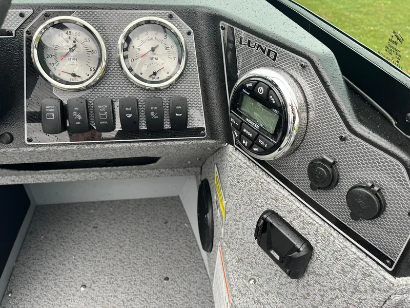 Slide: The Image of Dashboard of 2025 Lund 1775 Adventure Sport boat with gauges and controls. - 13