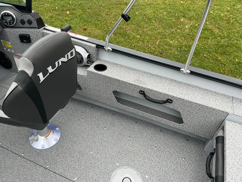 Slide: The Image of 2025 Lund 1775 Adventure Sport boat interior with seating and storage. - 18