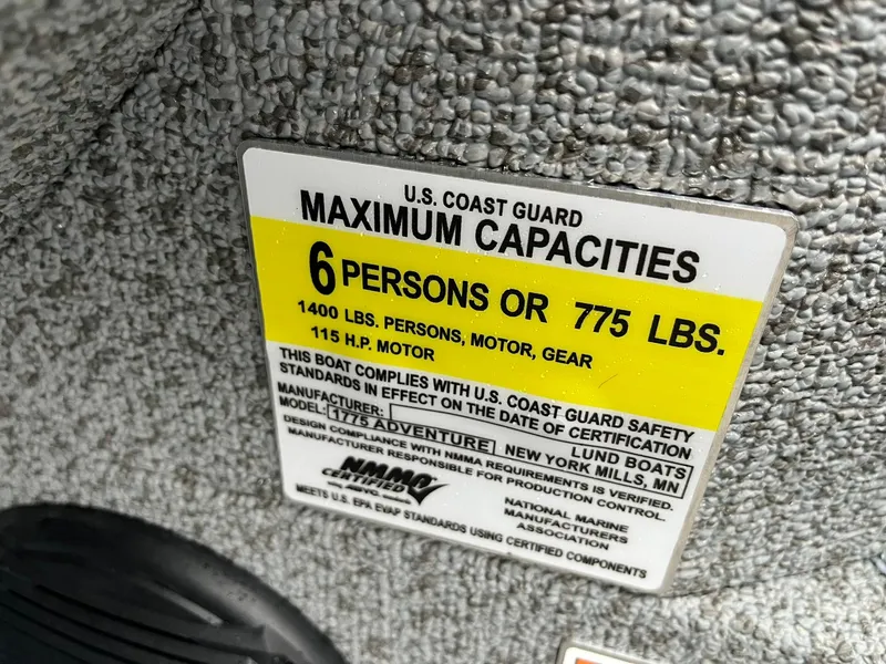 Slide: The Image of 2025 Lund 1775 Adventure Sport boat capacity label, 6 persons or 775 lbs, 115 HP motor. - 20