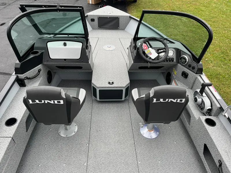 Slide: The Image of 2025 Lund 1775 Adventure Sport boat interior with dual seats and steering console. - 5