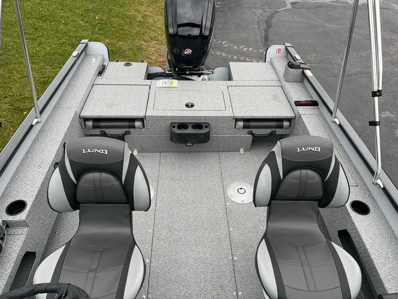 Slide: The Image of 2025 Lund 1775 Adventure Sport boat interior with two seats and storage compartments. - 6