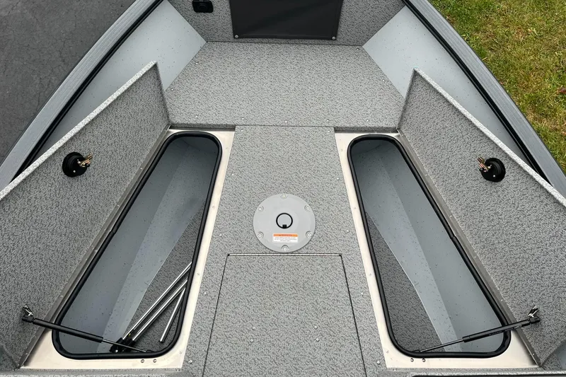 Slide: The Image of 2025 Lund 1775 Adventure Sport boat interior with open storage compartments. - 9