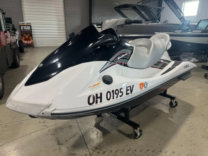 Slide: The Image of 2010 Yamaha WaveRunner VX Cruiser in showroom, white and black design. - 0