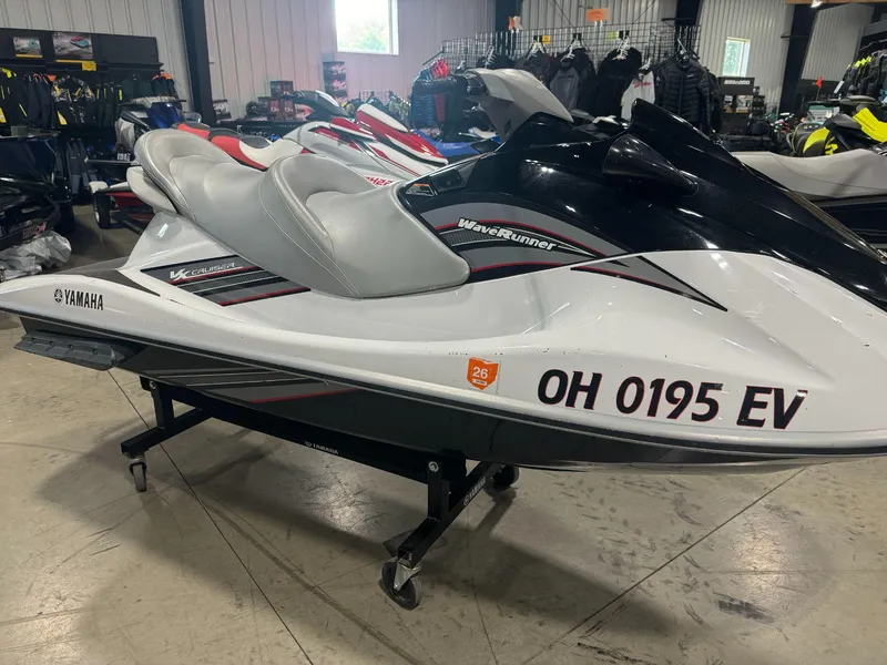 Slide: The Image of 2010 Yamaha WaveRunner VX Cruiser in showroom, white and black design. - 2