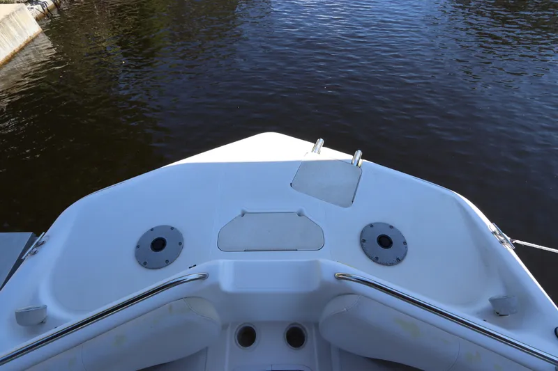 Slide: The Image of 2005 Hurricane FunDeck GS 201 OB boat deck, overlooking calm water. - 16