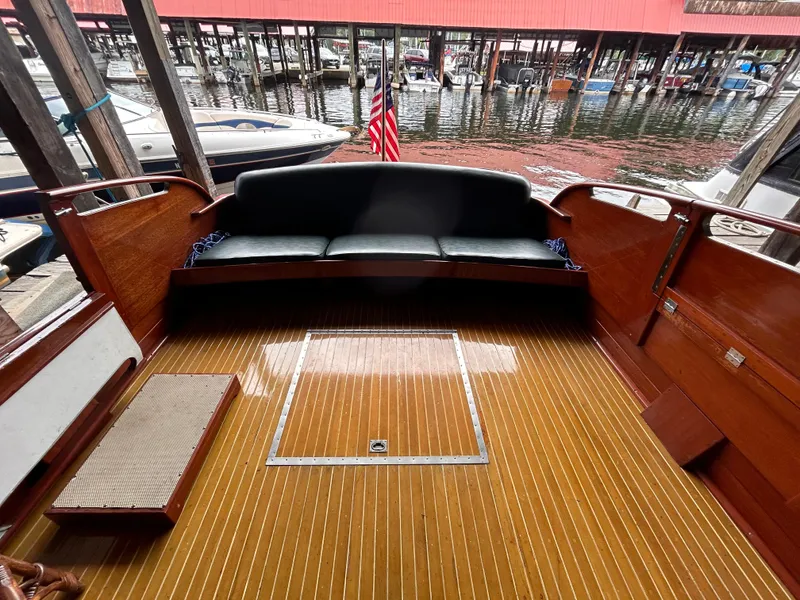 Slide: The Image of 1954 Chris-Craft Commander 336 Express Cruiser with wooden deck and seating, docked in marina. - 17
