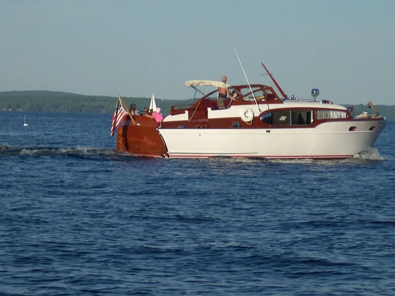 Slide: The Image of 1954 Chris-Craft Commander 336 Express Cruiser on a serene lake. - 2