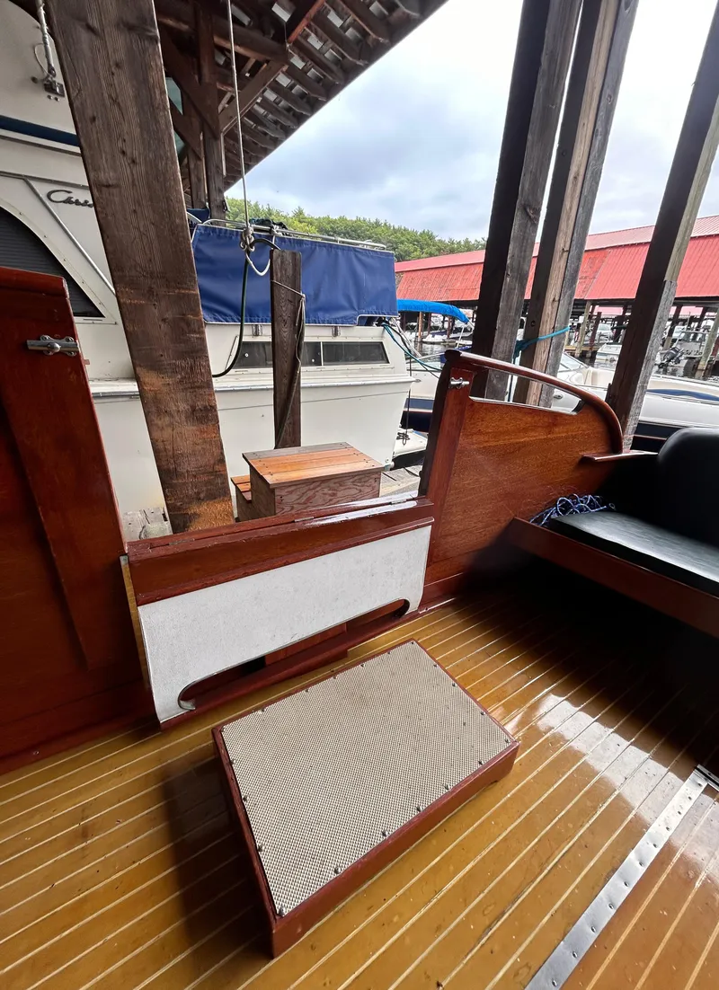 Slide: The Image of 1954 Chris-Craft Commander 336 Express Cruiser interior with wooden flooring and seating. - 21