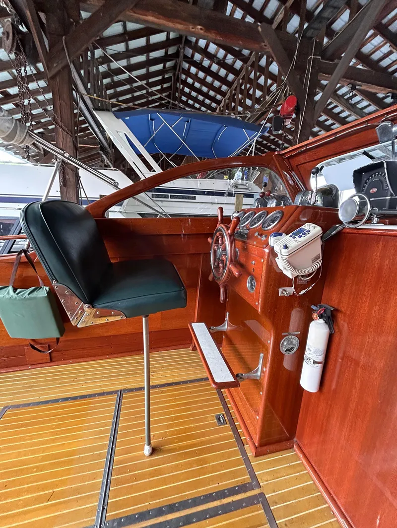 Slide: The Image of 1954 Chris-Craft Commander 336 Express Cruiser helm with vintage wooden dashboard and steering wheel. - 26