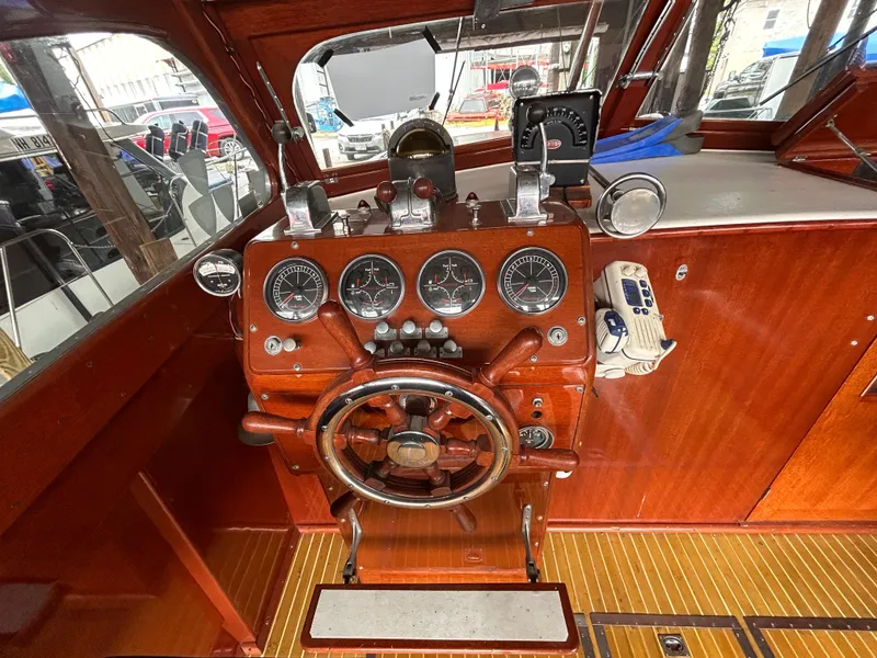 Slide: The Image of Vintage 1954 Chris-Craft Commander 336 Express Cruiser helm with classic wooden dashboard. - 27