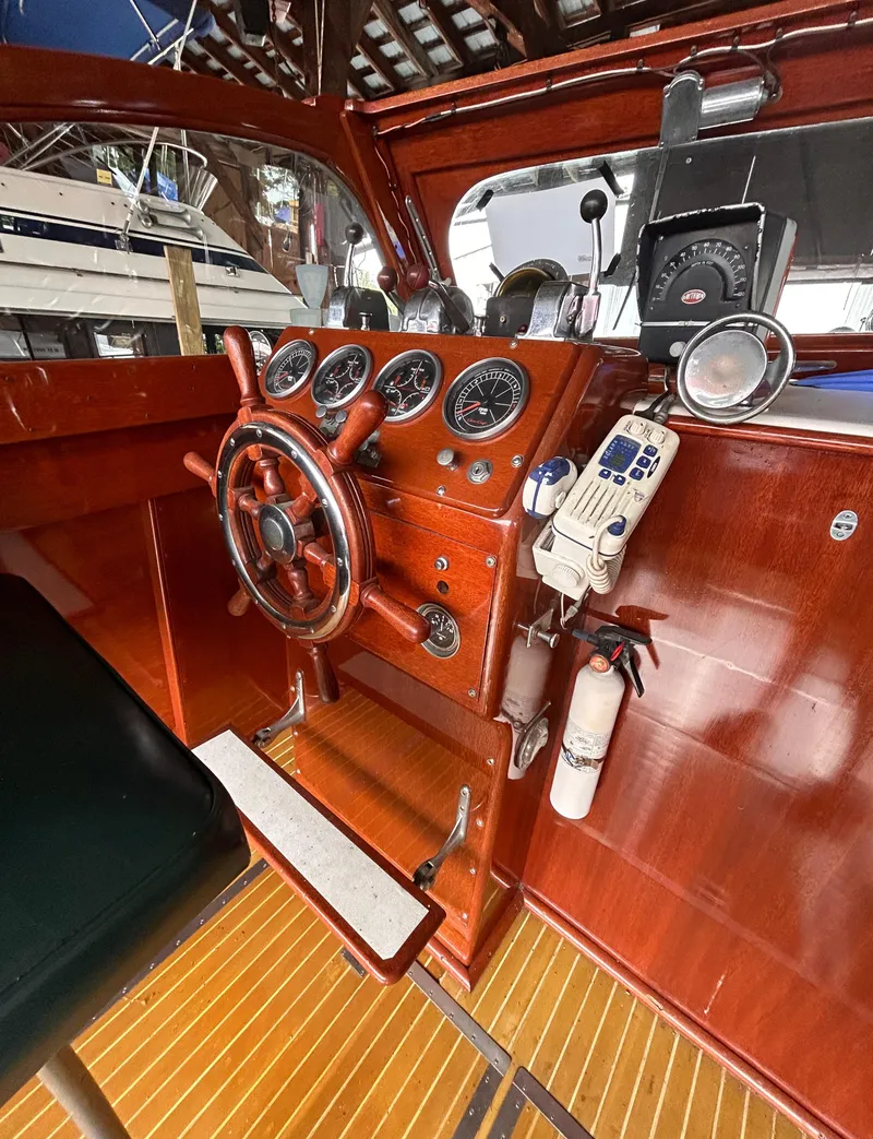 Slide: The Image of Vintage 1954 Chris-Craft Commander 336 Express Cruiser helm with classic wooden dashboard and gauges. - 28