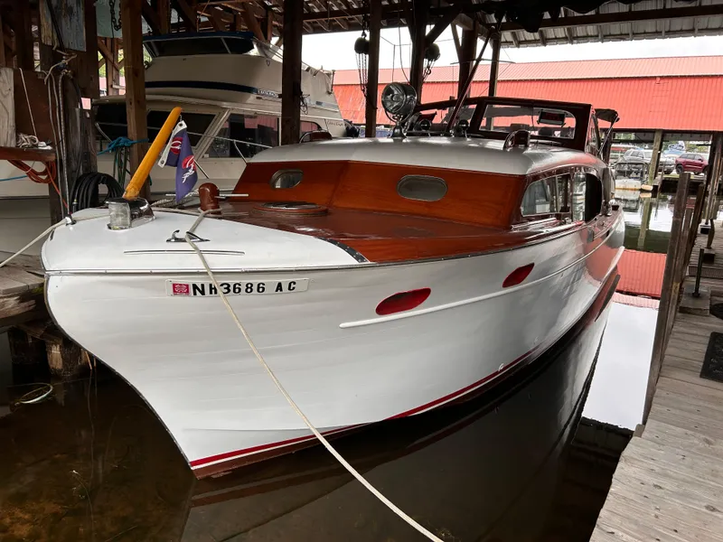 Slide: The Image of 1954 Chris-Craft Commander 336 Express Cruiser docked in a marina. - 3